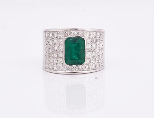 A white gold, emerald and diamond ring