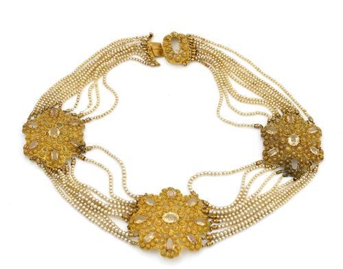 A gold, topaz and imitation pearl necklace