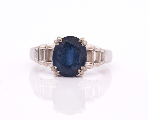 An 18ct white gold, sapphire and diamond ring