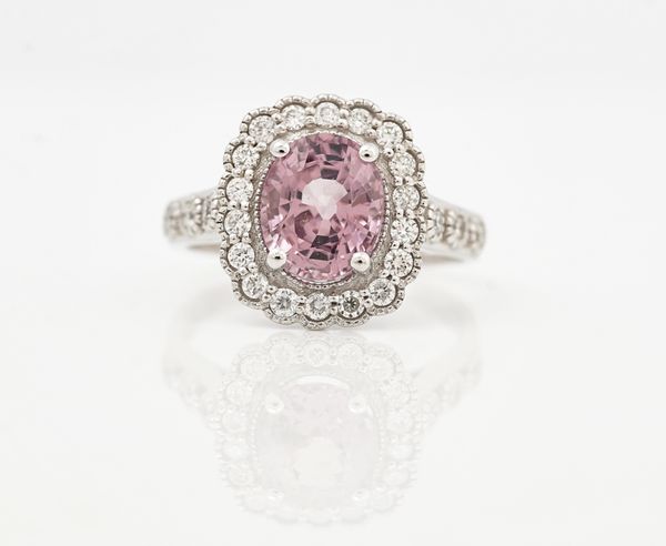 An 18ct white gold, pink spinel and diamond cluster ring