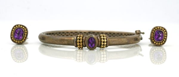 An amethyst set silver and gold hinged bangle and a pair of earrings, (2)