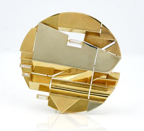 A two colour gold and diamond brooch