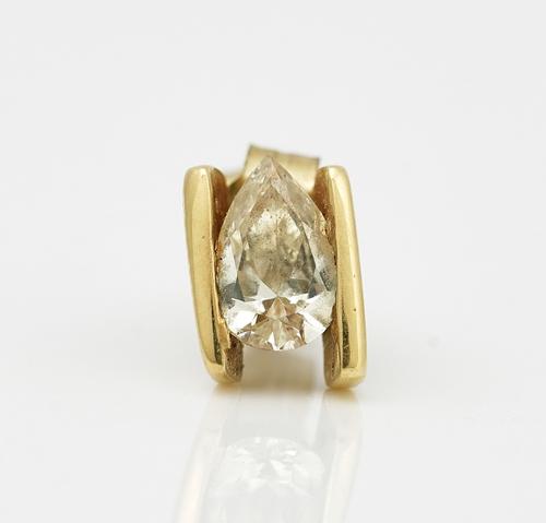 An 18ct gold earstud, mounted with a pear shaped diamond