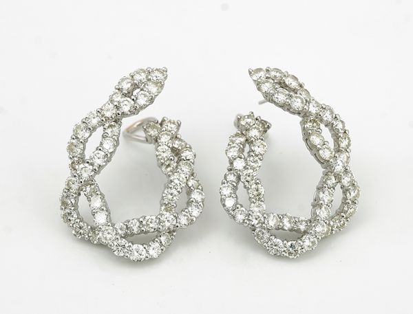 A pair of white gold and diamond set earrings