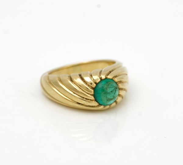 An 18ct gold and cabochon emerald single stone ring