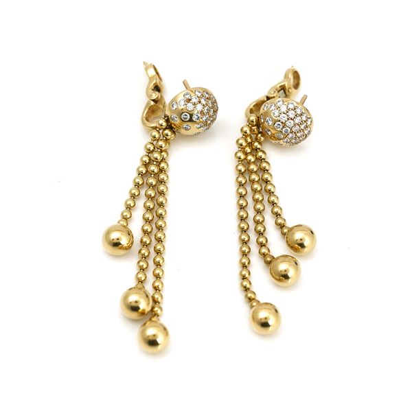 A pair of gold and diamond set pendant earrings detailed Cartier