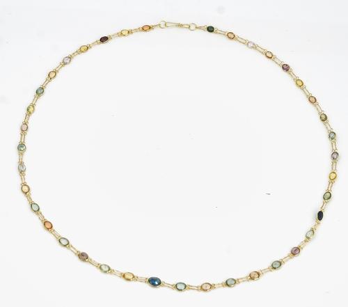 A gold and varicoloured sapphire necklace