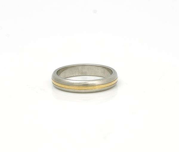 A platinum and yellow gold wedding band ring