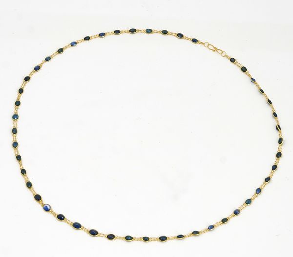 A gold and sapphire necklace
