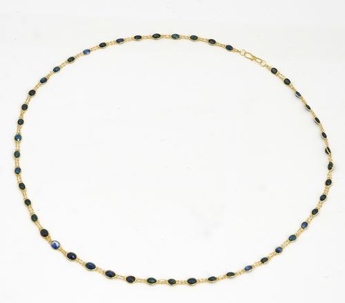 A gold and sapphire necklace