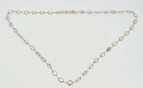 A gold and aquamarine necklace