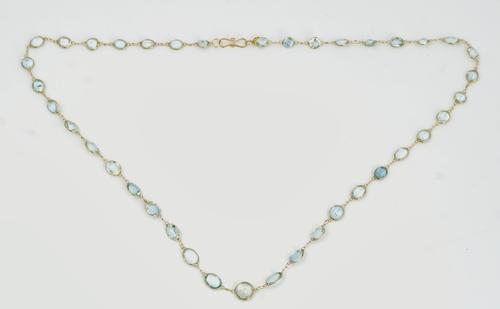 A gold and aquamarine necklace