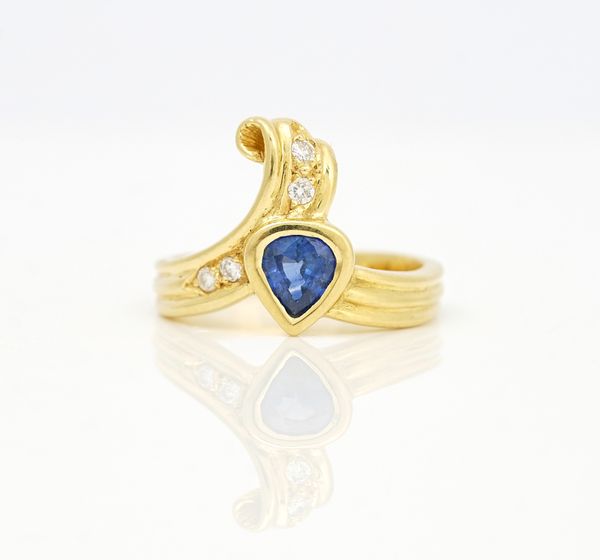 An 18ct gold, sapphire and diamond ring
