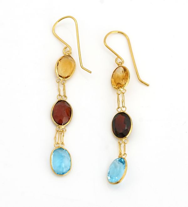 A pair of gold and varicoloured gemstone set three stone earrings