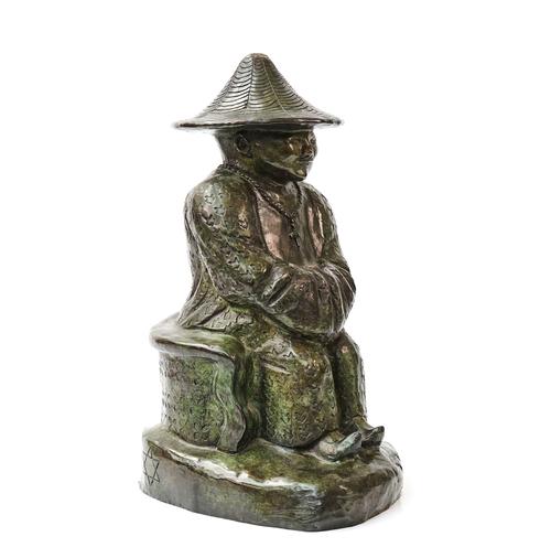 A MODERN BRONZE OF A SEATED SPIRITUAL MAN