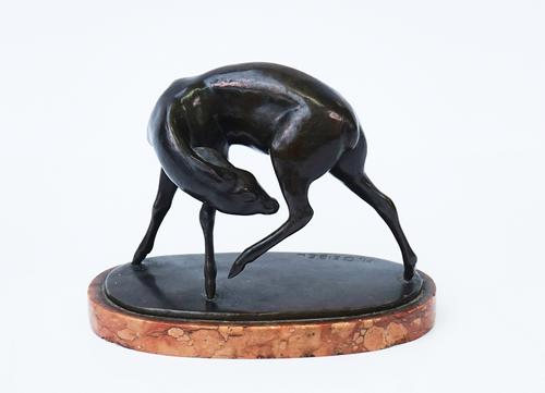 A BRONZE SCULPTURE OF A FAWN