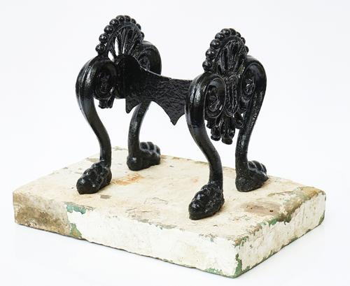 A REGENCY STYLE  BLACK PAINTED CAST-IRON BOOT SCRAPER
