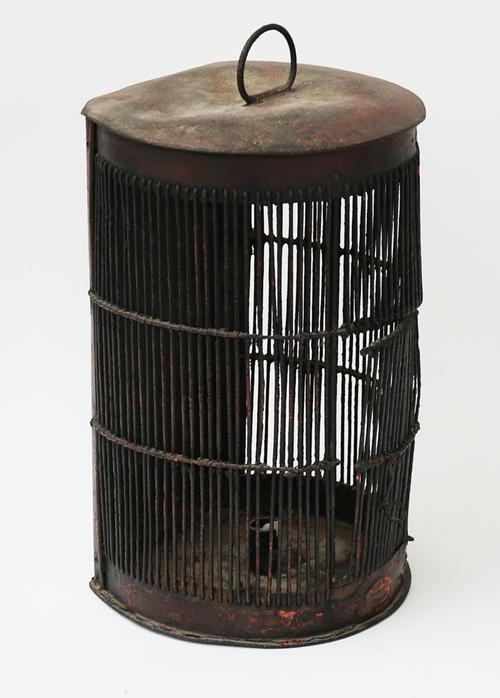 A WROUGHT IRON AND WIREWORK PENDANT LANTERN