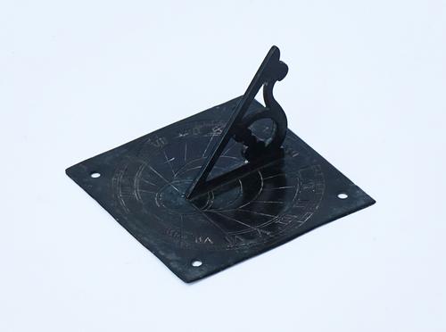 A SMALL BRONZE SUN DIAL
