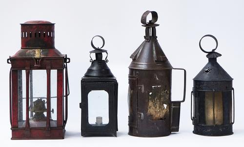 A GROUP OF FOUR SHEET METAL LANTERNS