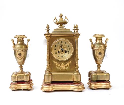 A FRENCH GILT-BRONZE THREE-PIECE CLOCK GARNITURE