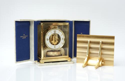 A JAEGER LE-COULTRE ATMOS CLOCK AND WALL BRACKET