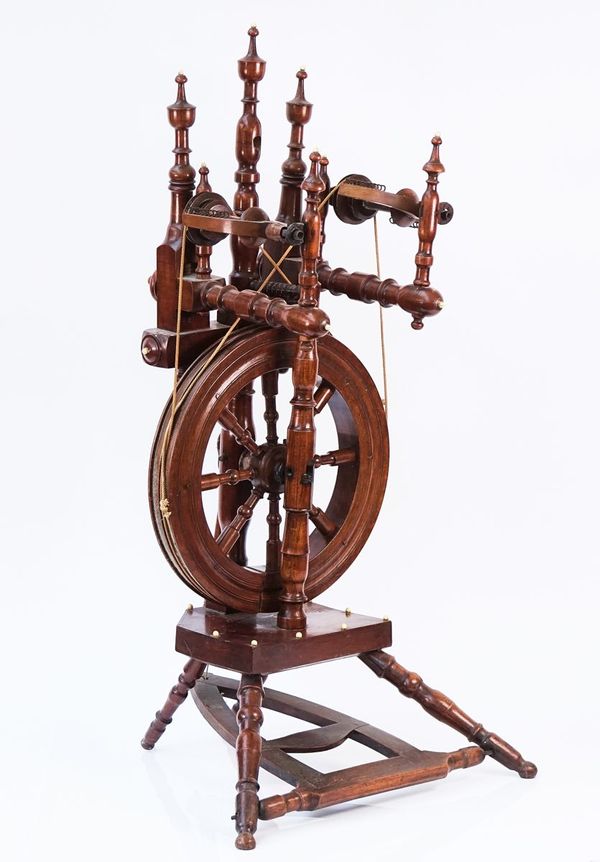 A 19TH CENTURY BEECH AND FRUITWOOD SPINNING WHEEL
