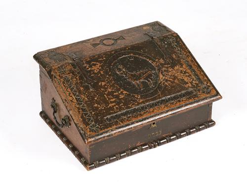 A GEORGE I CARVED OAK SLOPE FRONT DESK BOX
