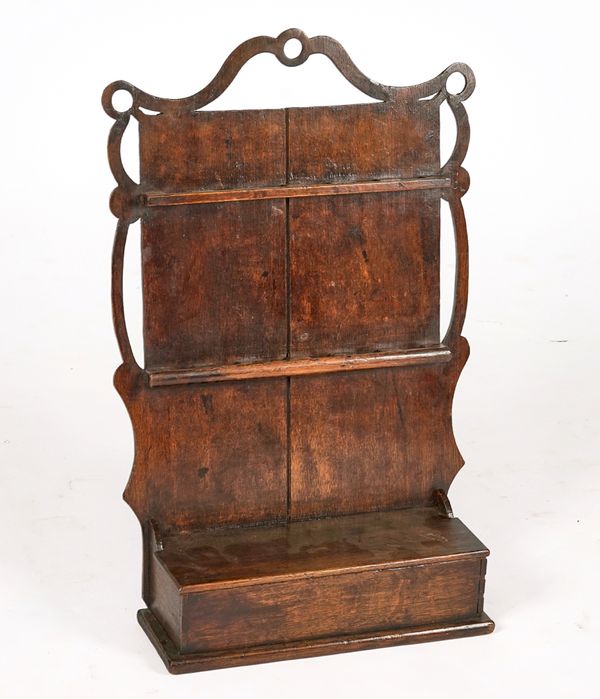 AN 18TH CENTURY OAK HANGING CUTLERY AND SPOON RACK