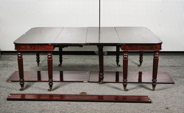 A 19TH CENTURY MAHOGANY EXTENDING DINING TABLE IN THE MANNER OF GILLOWS