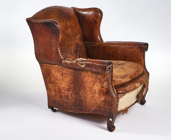 A MID-20TH CENTURY FRENCH WING-BACK EASY ARMCHAIR