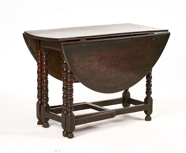 A CHARLES II JOINED OAK GATELEG TABLE