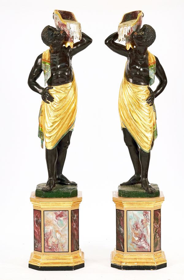 A PAIR OF EARLY 20TH CENTURY  VENETIAN PARCEL-GILT, POLYCHROME DECORATED EBONISED BLACKAMOORS