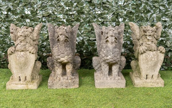 A PAIR OF RECONSTITUTED STONE FIGURES OF SEJANT GRIFFINS (4)