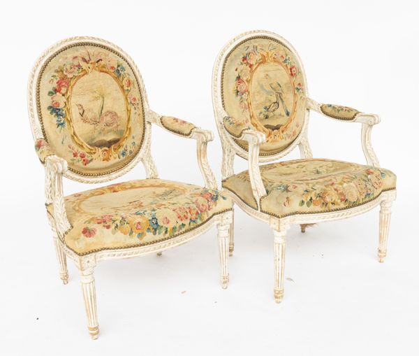 A PAIR OF LATE 18TH CENTURY FRENCH GREY PAINTED BEECH FRAMED OPEN ARMCHAIRS (2)