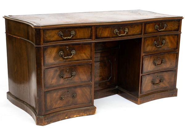 A 19TH CENTURY MAHOGANY SERPENTINE SHAPED PEDESTAL DESK