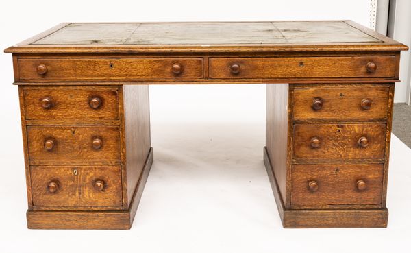 A 19TH CENTURY OAK PEDESTAL DESK