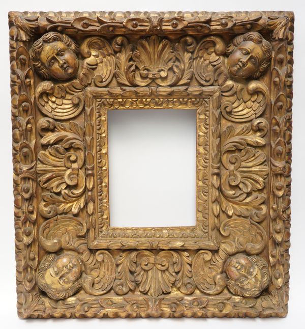 A 19TH CENTURY CARVED AND GOLD PAINTED MIRROR/PICTURE FRAME