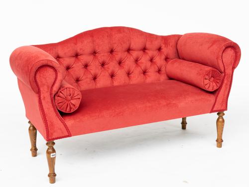 A SMALL REGENCY STYLE HUMP BACK SOFA