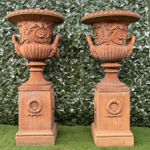 A PAIR OF TERRACOTTA TWIN-HANDLE JARDINIÈRES