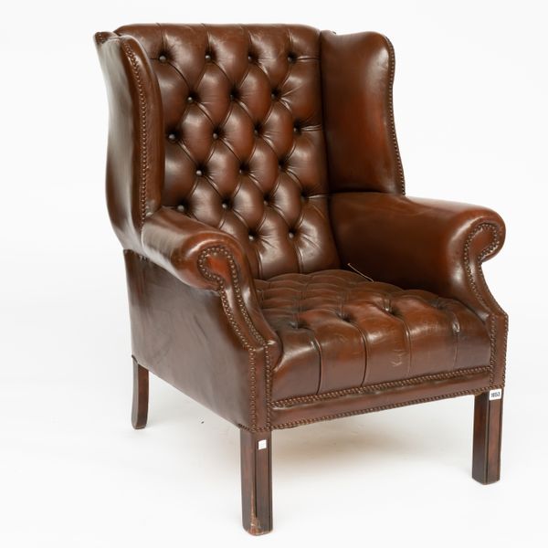 A GEORGE II STYLE STUDDED TAN LEATHER UPHOLSTERED WINGBACK ARMCHAIR