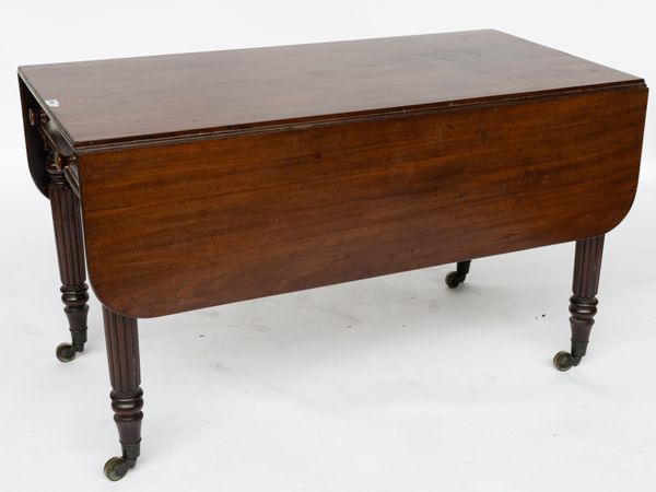 A LARGE REGENCY MAHOGANY DROP FLAP SUPPER TABLE