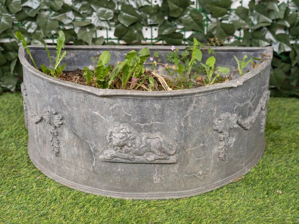 A LEAD FLORAL SWAG CAST SEMI-ELLIPTIC PLANTER