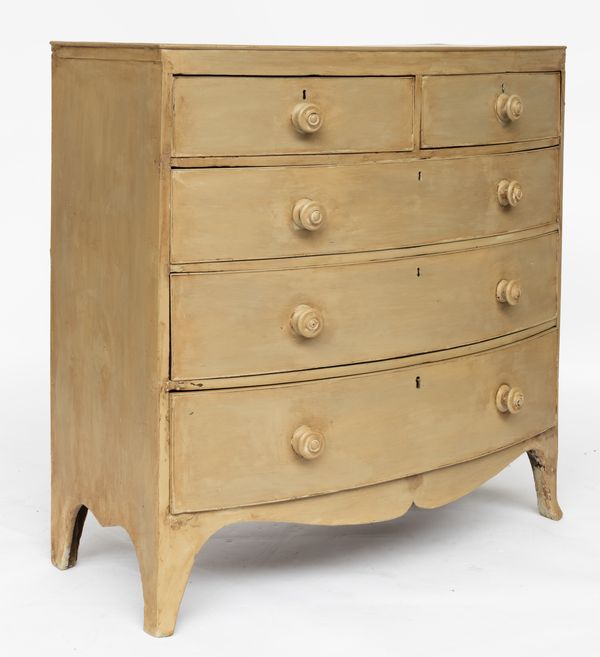 A REGENCY LATER TAUPE PAINTED BOW FRONT CHEST OF DRAWERS