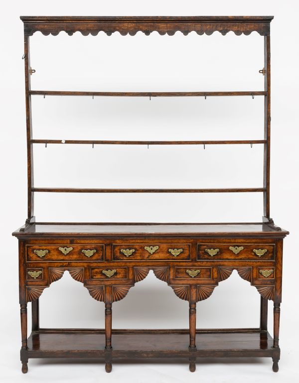 AN 18TH CENTURY OAK POT BOARD DRESSER WITH OPEN THREE TIER RACK