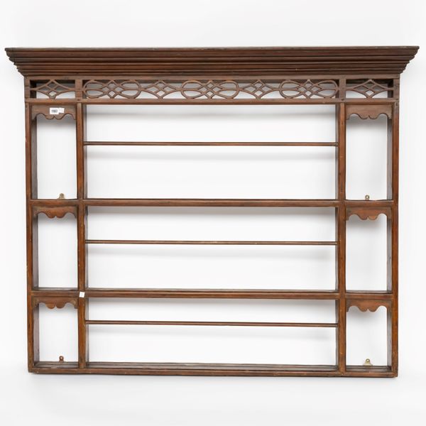 A GEORGE III PINE FOUR TIER PLATE RACK WITH PIERCED FRET FRIEZE