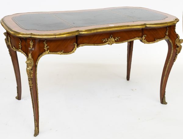 IN THE MANNER OF LOUIS XV; A FRENCH ORMOLU MOUNTED SHAPED RECTANGULAR SINGLE DRAWER BUREAU PLAT/WRITING DESK