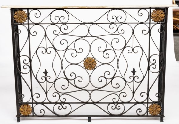 A PARCEL-GILT WROUGHT IRON RADIATOR COVER