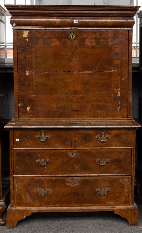 A WILLIAM & MARY FEATHER-BANDED WALNUT SECRETAIRE ON CHEST