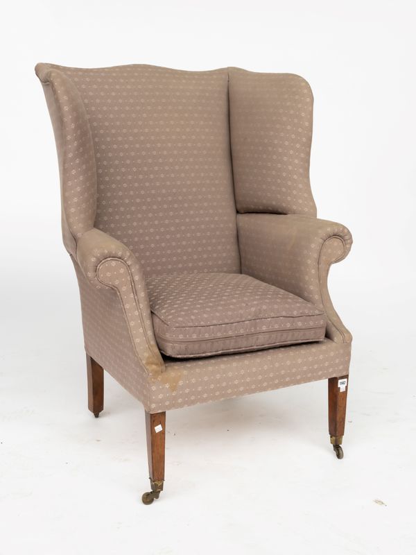 A GEORGE III MAHOGANY FRAMED WINGBACK ARMCHAIR